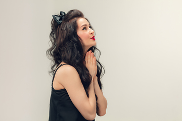 Image showing Portrait of beautiful young woman isolated on grey studio background