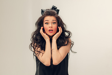 Image showing Portrait of beautiful young woman isolated on grey studio background