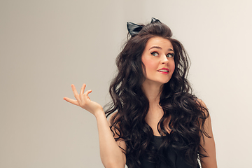 Image showing Portrait of beautiful young woman isolated on grey studio background