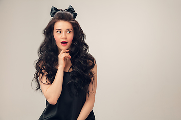 Image showing Portrait of beautiful young woman isolated on grey studio background