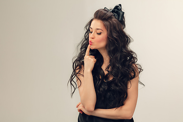 Image showing Portrait of beautiful young woman isolated on grey studio background