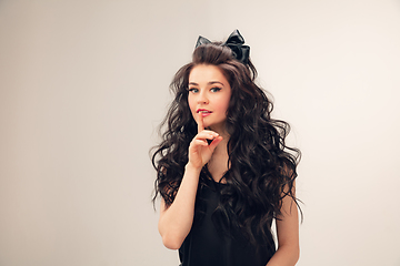 Image showing Portrait of beautiful young woman isolated on grey studio background