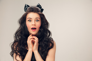 Image showing Portrait of beautiful young woman isolated on grey studio background