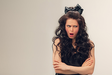 Image showing Portrait of beautiful young woman isolated on grey studio background