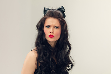 Image showing Portrait of beautiful young woman isolated on grey studio background