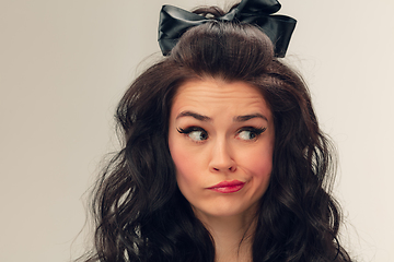 Image showing Close up portrait of beautiful young woman isolated on grey studio background