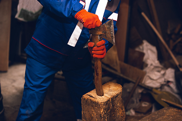 Image showing Close up of hands of repairman, professional builder working outdoors, repairing