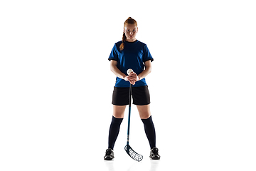 Image showing Floorball female player isolated on white studio background, action and motion concept