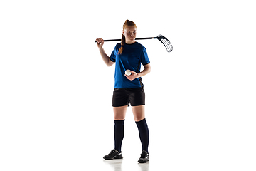 Image showing Floorball female player isolated on white studio background, action and motion concept