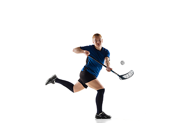 Image showing Floorball female player isolated on white studio background, action and motion concept