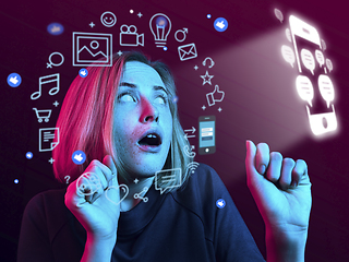 Image showing Woman using interface modern technology and digital layer effect for social media displaying, looks shocked, scared