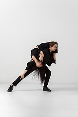 Image showing Young and graceful ballet dancers in minimal black style isolated on white studio background