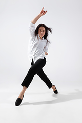 Image showing Young and graceful ballet dancer in minimal black style isolated on white studio background