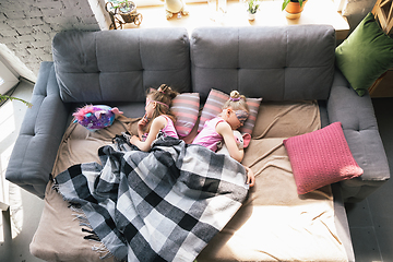 Image showing Quiet little girls sleeping in a bedroom in cute pajamas, home style and comfort