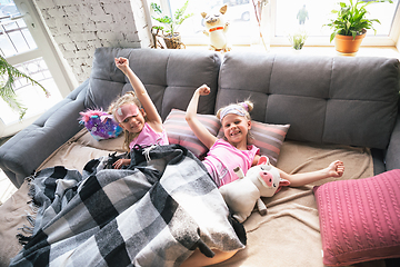 Image showing Quiet little girls waking up in a bedroom in cute pajamas, home style and comfort
