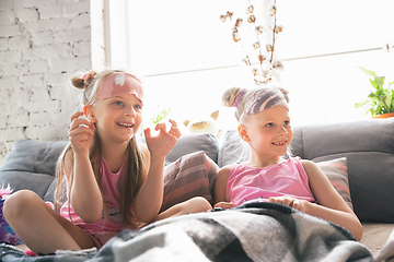 Image showing Quiet little girls waking up in a bedroom in cute pajamas, home style and comfort