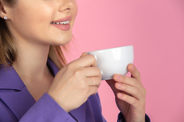 Image showing Caucasian young woman\'s close up portrait on pink studio background, emotional and expressive