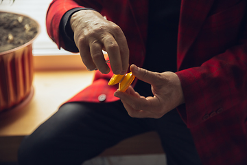 Image showing Close up of senior man with retro toys, meeting things from the past and having fun, exploring the lifestyle of the nineties, playing with yo-yo