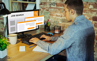 Image showing Man looking for a job during worldwide crisis. Find a job online. Business, internet and networking concept. Modern search bar design.