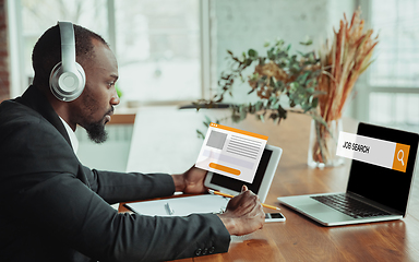 Image showing Man looking for a job during worldwide crisis of coronavirus pandemic. Find a job online. Business, internet and networking concept.