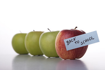 Image showing Apples in line to school