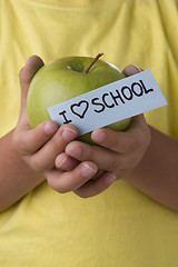 Image showing detail of a kid hands with a apple