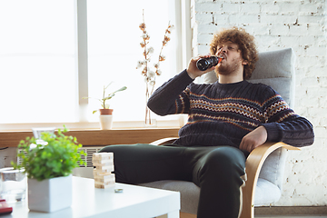 Image showing Portrait of millenial boy with retro style, meeting things from the past and having fun, nostalgic the lifestyle of the nineties