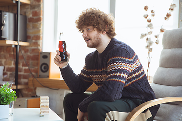 Image showing Portrait of millenial boy with retro style, meeting things from the past and having fun, nostalgic the lifestyle of the nineties