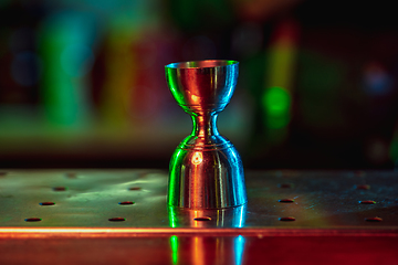 Image showing Close up of alcoholic shot in multicolored neon light