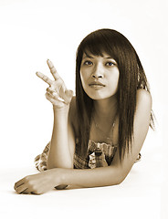 Image showing young asian peace girl