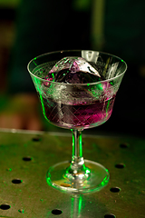 Image showing Close up of alcoholic cocktail, beverage, drink in multicolored neon light