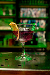 Image showing Close up of alcoholic cocktail, beverage, drink in multicolored neon light