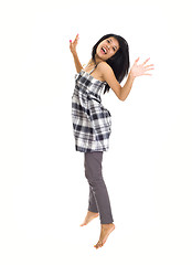 Image showing Young asian girl jumping for joy