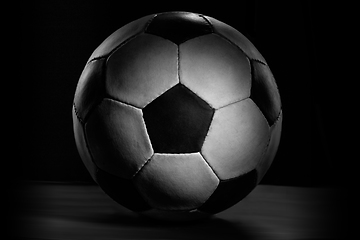 Image showing Professional sport equipment isolated on black studio background. Soccer ball.