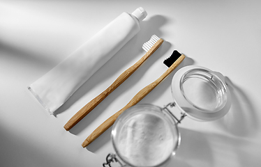 Image showing washing soda and wooden toothbrushes