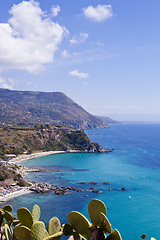 Image showing View of turquoise gulf bay, sandy beach, green mountains and pla