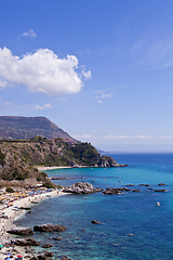 Image showing View of turquoise gulf bay, sandy beach, green mountains and pla