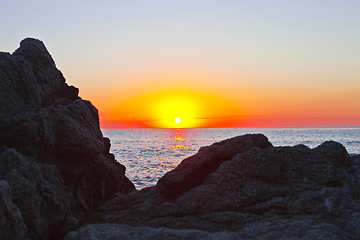 Image showing Sunset on the rocky shore. Tyrrhenian Sea.