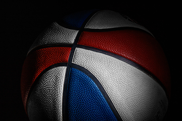 Image showing Professional sport equipment isolated on black studio background. Basketball ball.