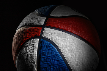 Image showing Professional sport equipment isolated on black studio background. Basketball ball.