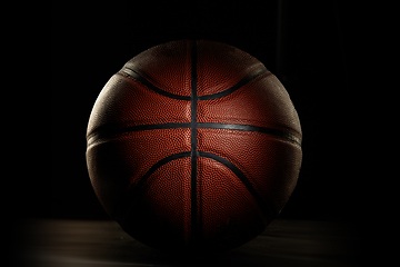 Image showing Professional sport equipment isolated on black studio background. Basketball ball.