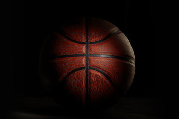 Image showing Professional sport equipment isolated on black studio background. Basketball ball.