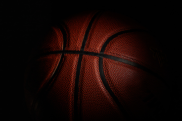 Image showing Professional sport equipment isolated on black studio background. Basketball ball.