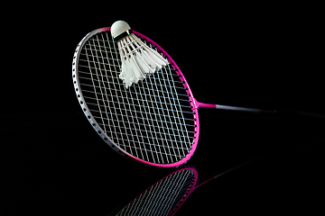 Image showing Professional sport equipment isolated on black studio background. Badminton racket.