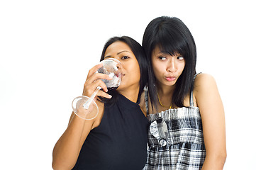 Image showing two asian girls with red wine