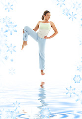 Image showing yoga standing on white sand