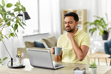 Image showing sick indian man with sore throat working at home