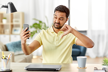 Image showing indian man having video call on smartphone at home