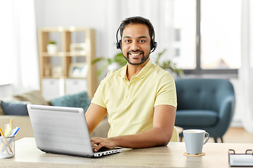 Image showing indian man with headset and laptop working at home