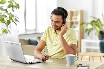 Image showing indian man with headset and laptop working at home